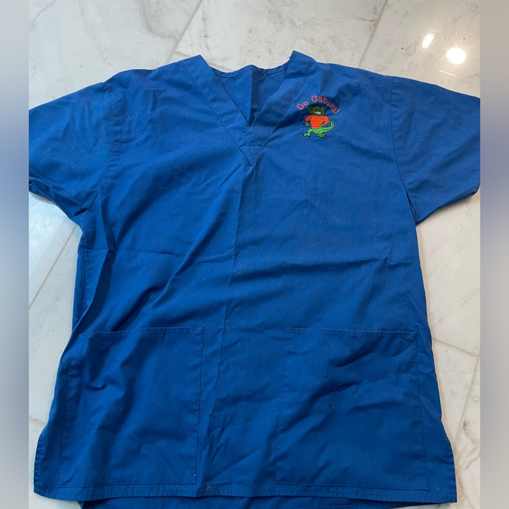 UF Gators ! Florida gators scrubs top, blue women’s. Size tags gone; fits S/M